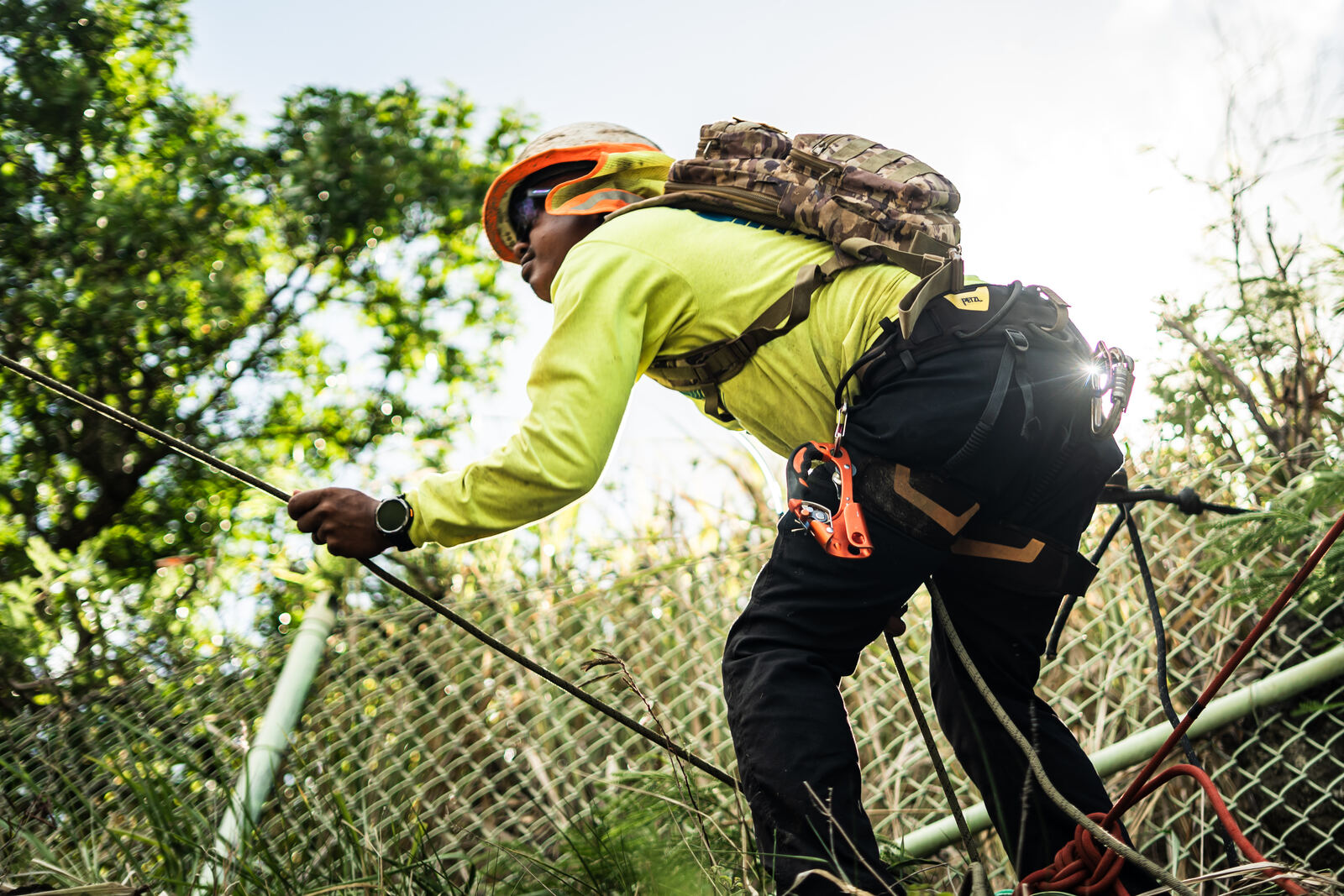 Technician working along a rope on the slope